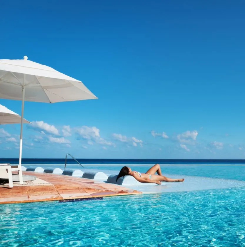 Woman Tanning at Pool in Cancun