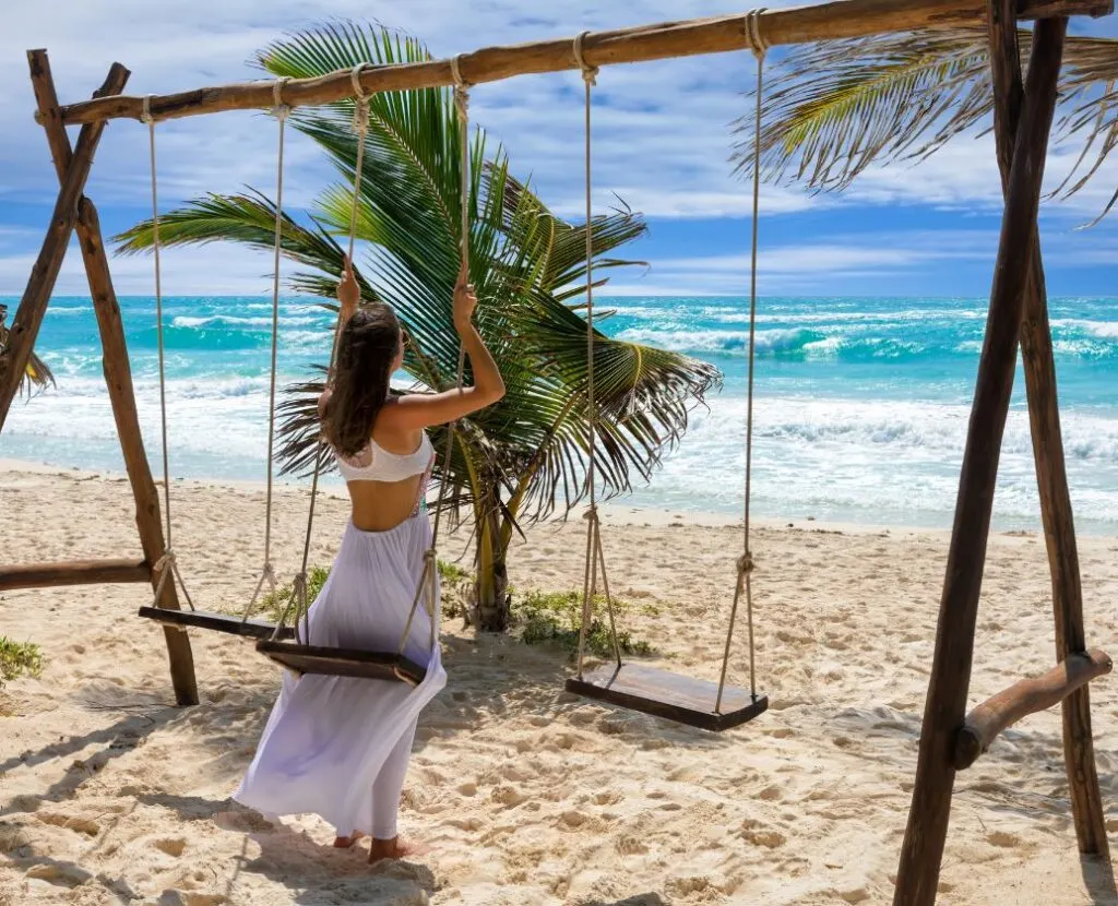 Tulum-Female-Tourist-on-Swing-at-Beach