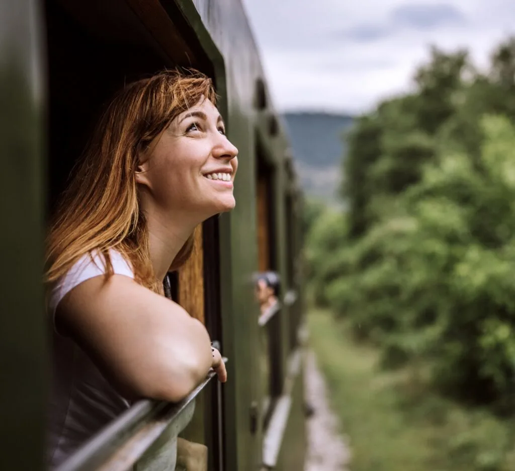 Happy woman on train