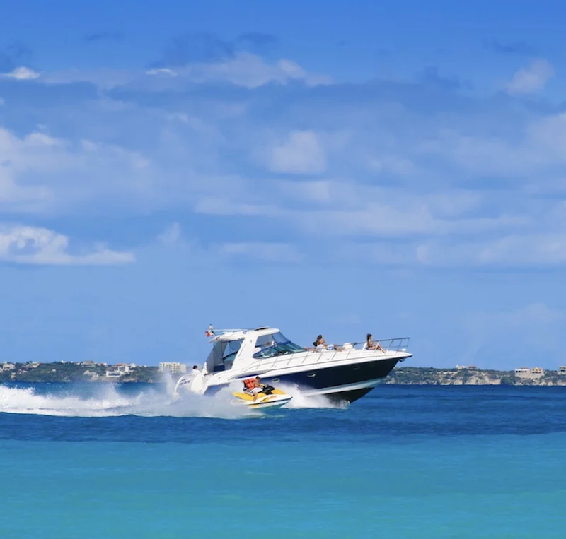 Luxury yacht in the water in Cancun, Mexico with people on it.