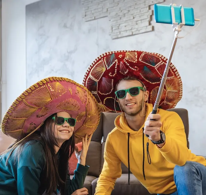 tourists sombrero selfie stick