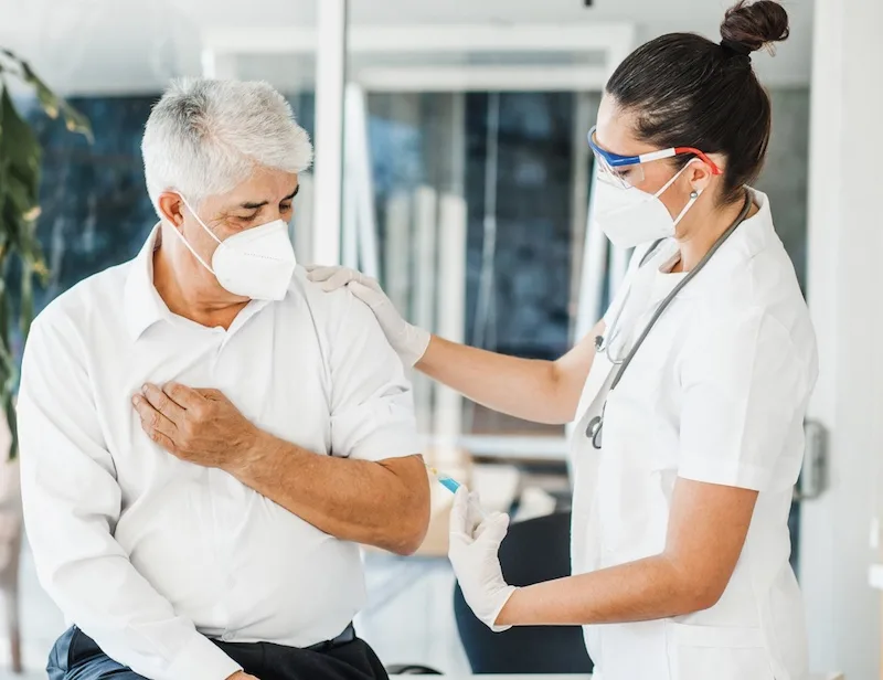 elderly Mexican man receiving vaccination