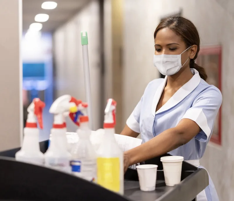 hotel staff cleaning mask