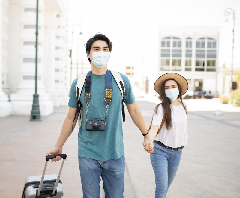 travelers in Mexico face masks