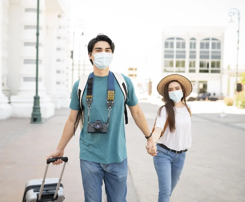 travelers in Mexico face masks