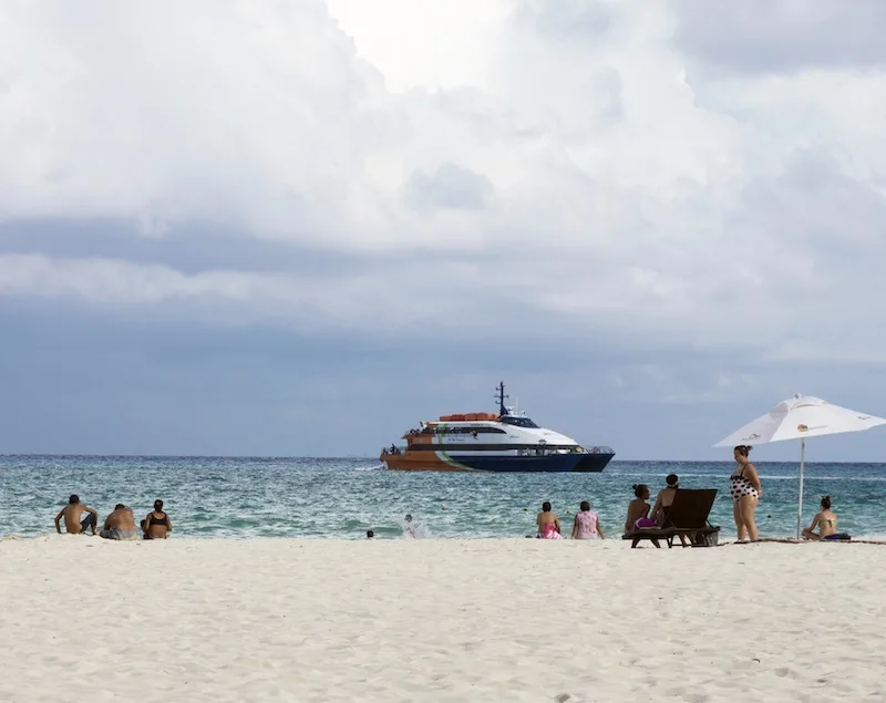 Cancun beach tourists