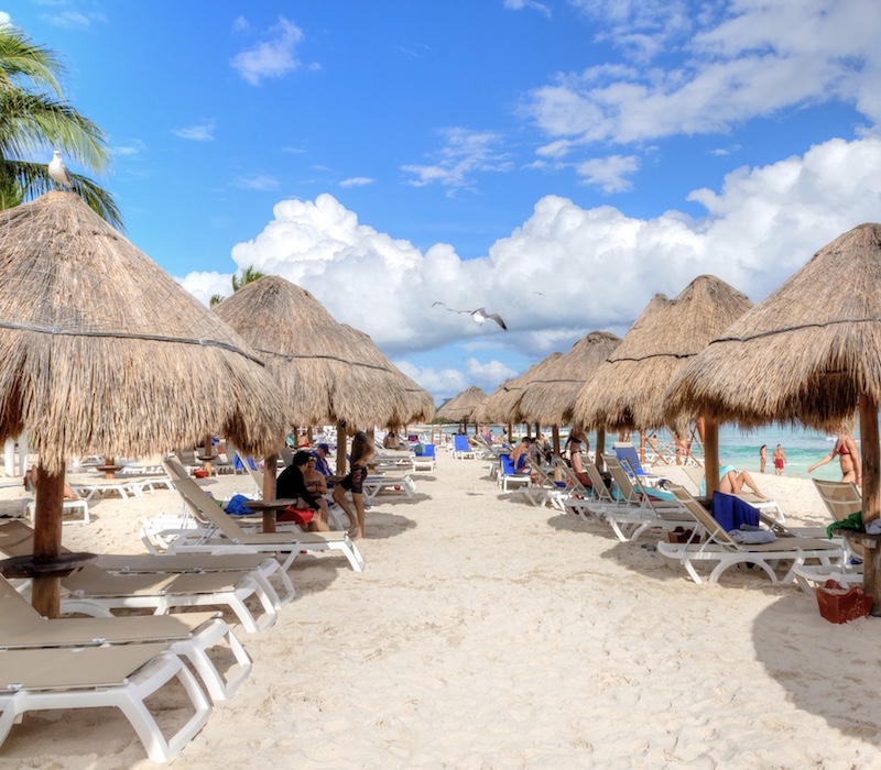 Cancun beach tourists