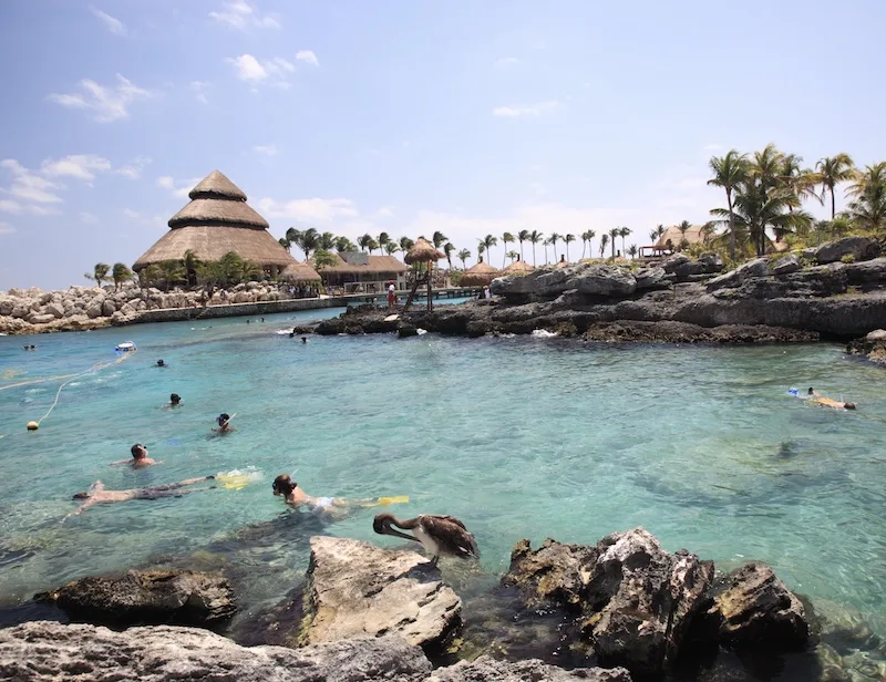 tourists snorkeling in Xcaret Cancun