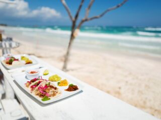 Tulum is known for its chill, charming and boho vibes. Wanderlusts from far and wide travel here to experience peace through activities like yoga, meditation & beach bummin’. What better way to fuel and enhance your ultimate vacation in paradise than to indulge in a little bit of soul food. Here are 6 top rated food and wine tours that the region has to offer.