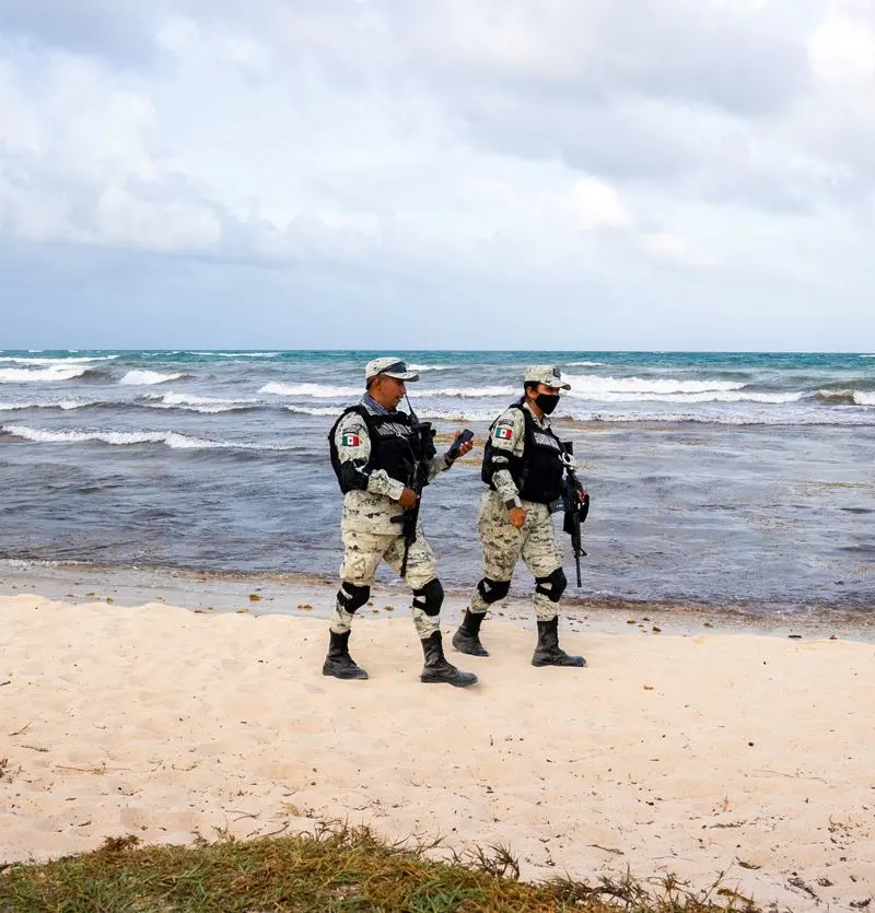 Military soliders on beach in Tulum