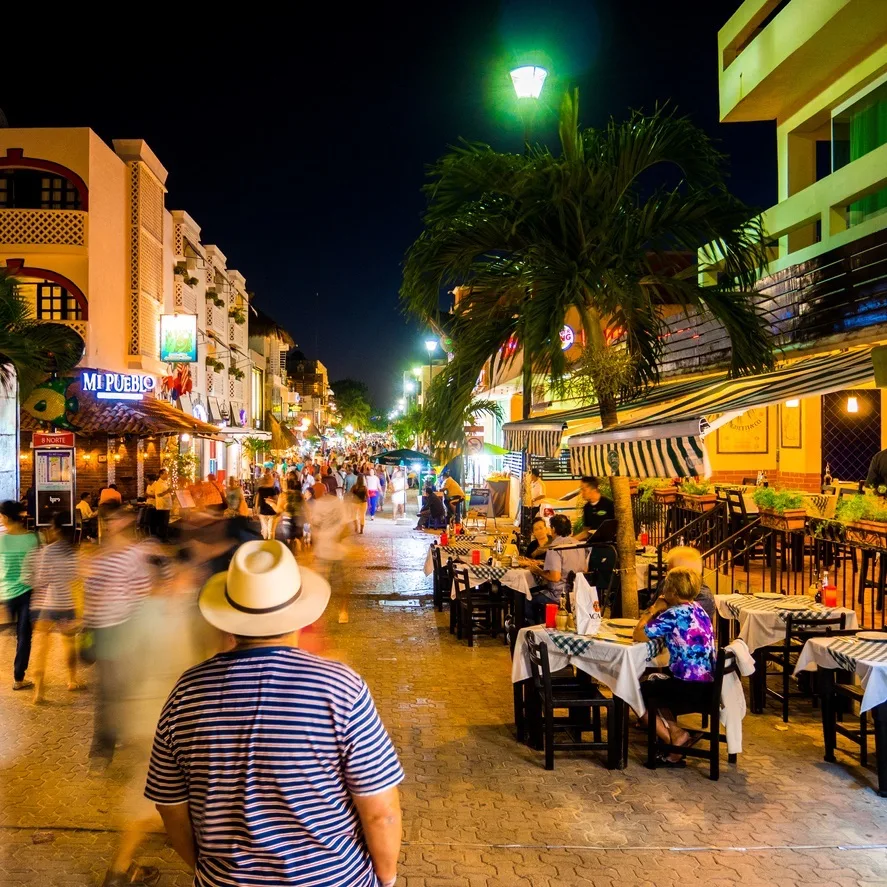 people on a street in playa del carmen