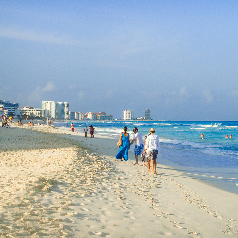 tourists on cancun beach