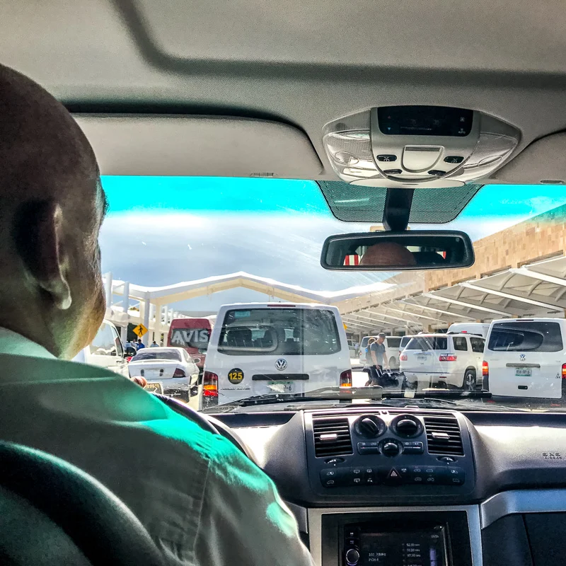 Taxi Driver in a Taxi Vehicle at Cancun Airport