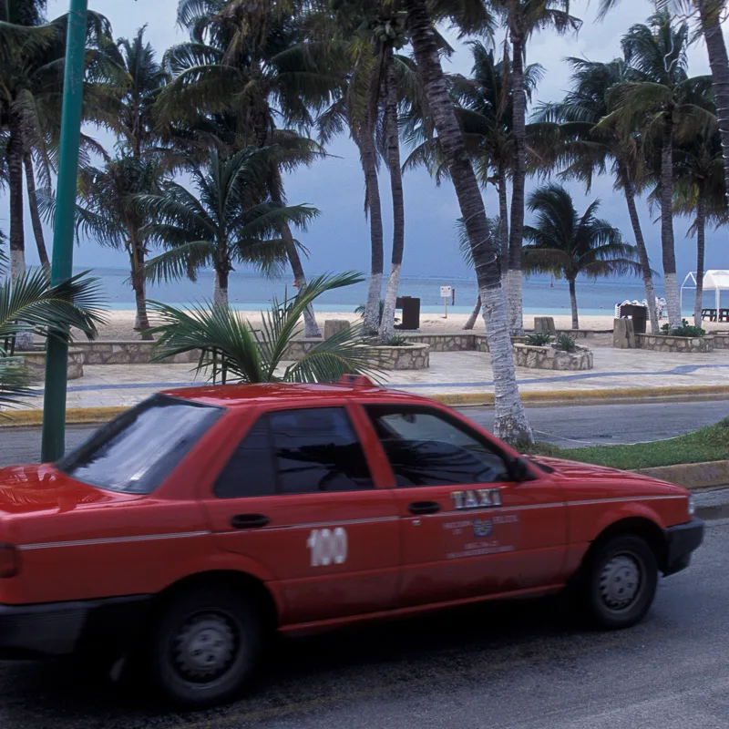 Rundown Taxi Driving on the Streets in Cancun, Mexico