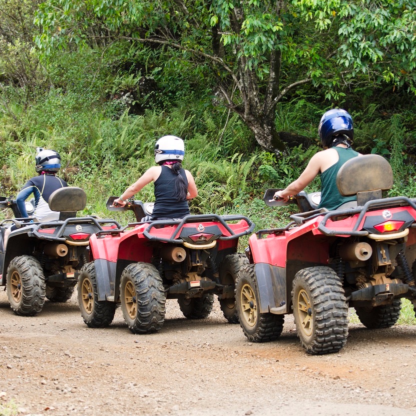 Travelers on a jungle ATV tour