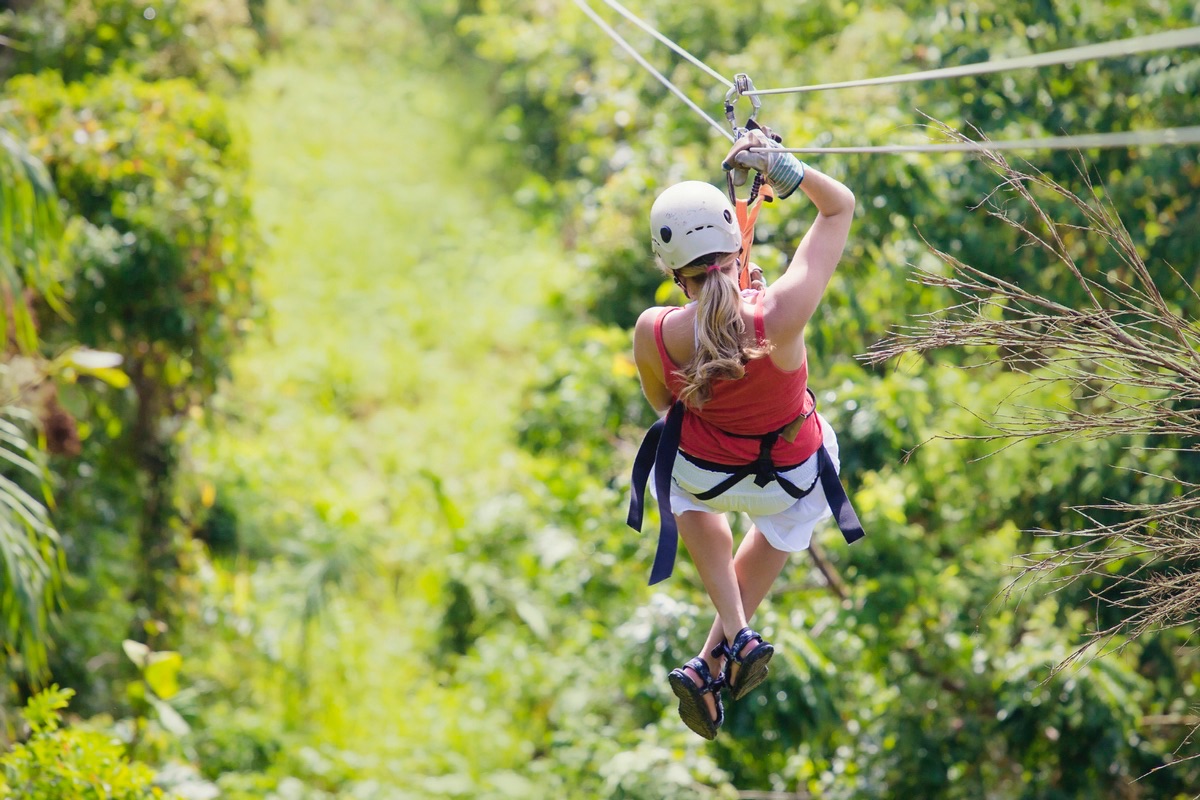 Woman going on a jungle zipline adventure