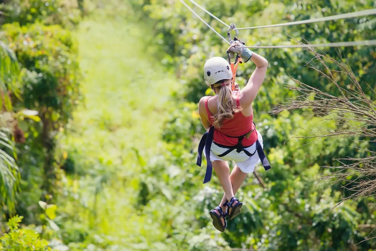 Woman going on a jungle zipline adventure