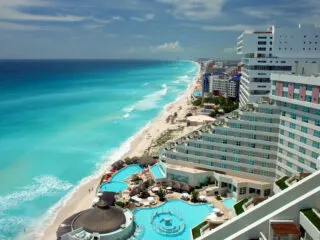 Cancun Tourists See Cancellations, Stripped Service, And Closures