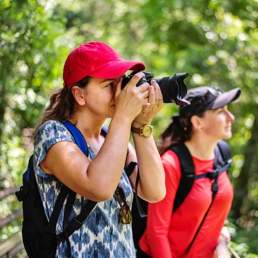 woman with camera, in the park