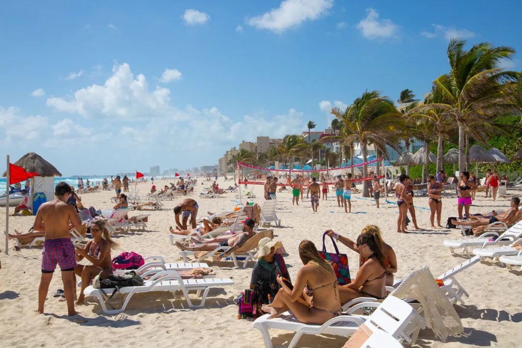 Tourists relaxing on the beach