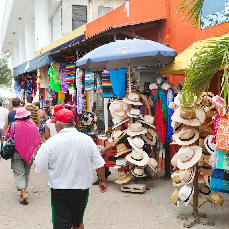 Hat Shop and other souvenir stores on a main street in Isla Mujeres, Mexico.