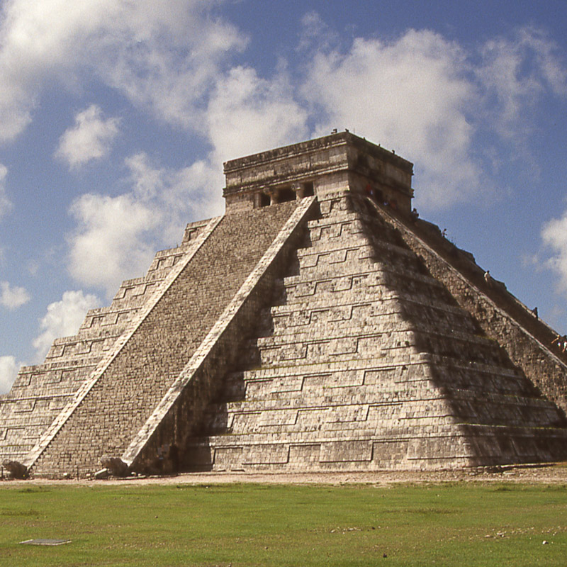 chichen itza pyramid in all its glory during the day, no tourists around.