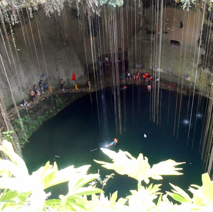 People Swimming in Cenote