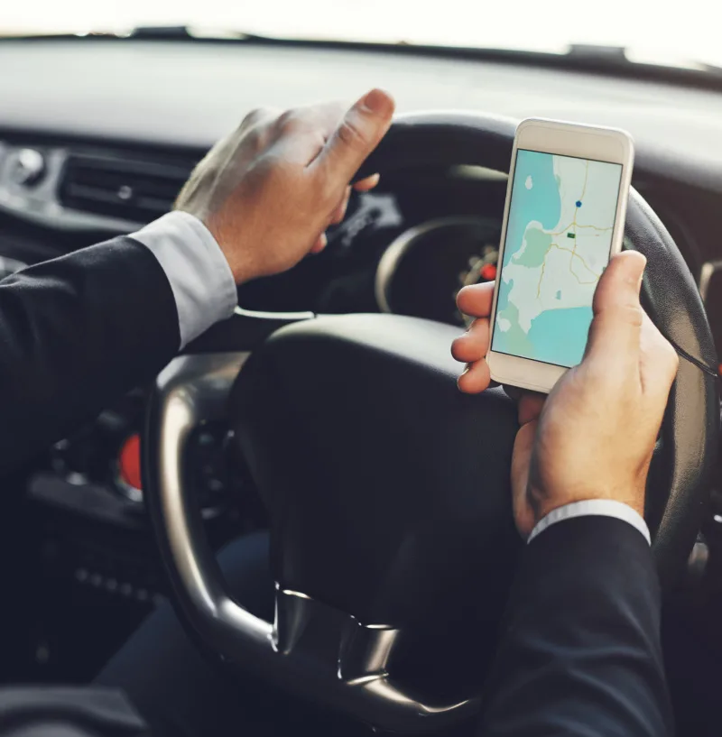 Driver Navigating on a Smartphone