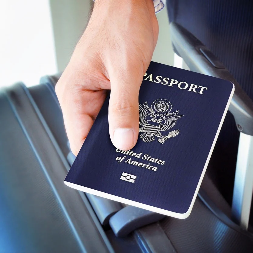 Hand holding U.S. passport