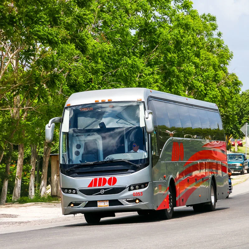 ADO Bus Driving on a Street in Mexico