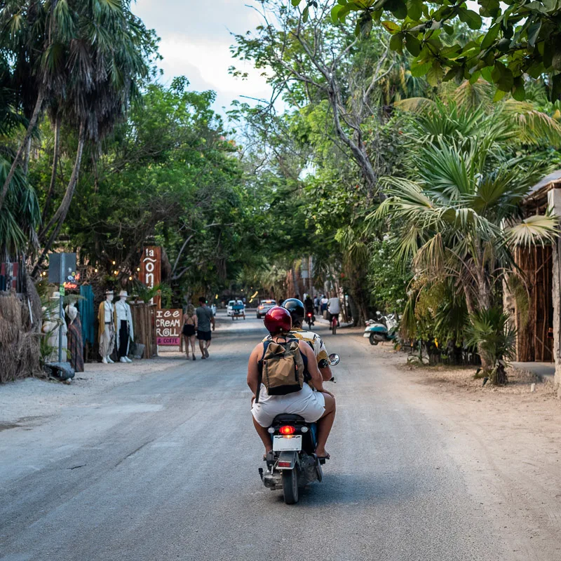 People riding a moped