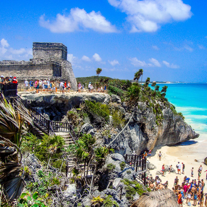 Tourists visiting the Tulum Ruins in the Mexican Caribbean.