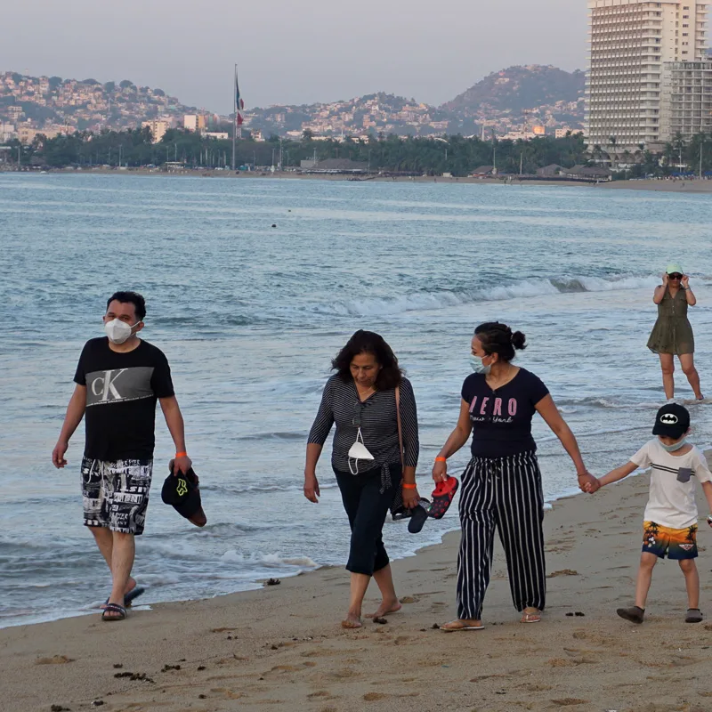 family walking with masks on