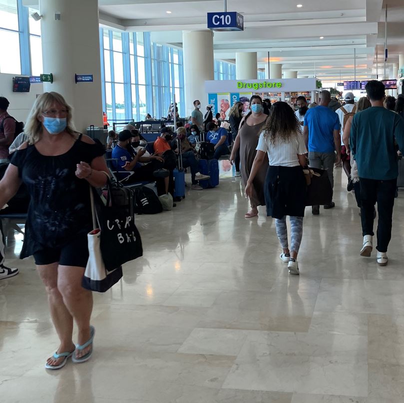 People Wearing Masks At Cancun Airport