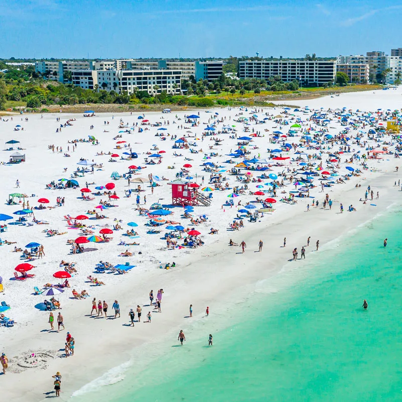 cancun beach filled with swimmers and bathers