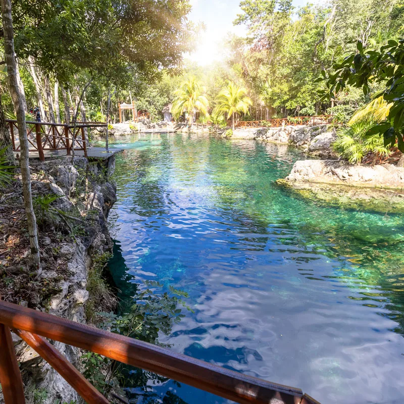 open air cenote near cancun during the day