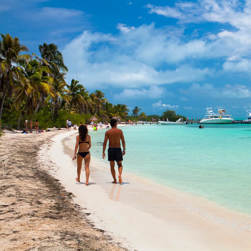 couple walking on mexican beach