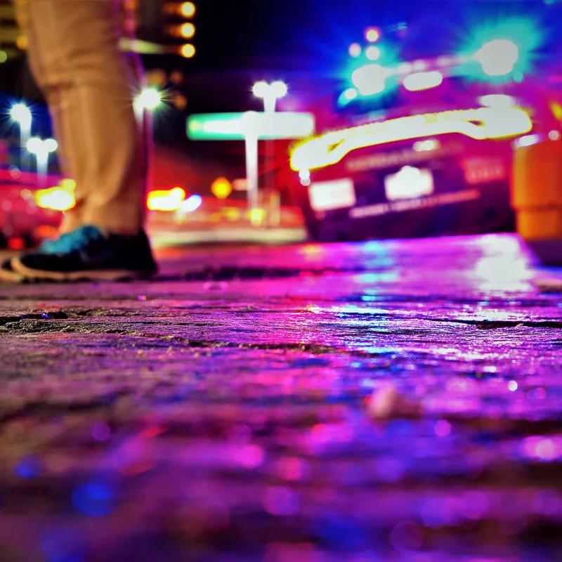 police car and cop at night in cancun