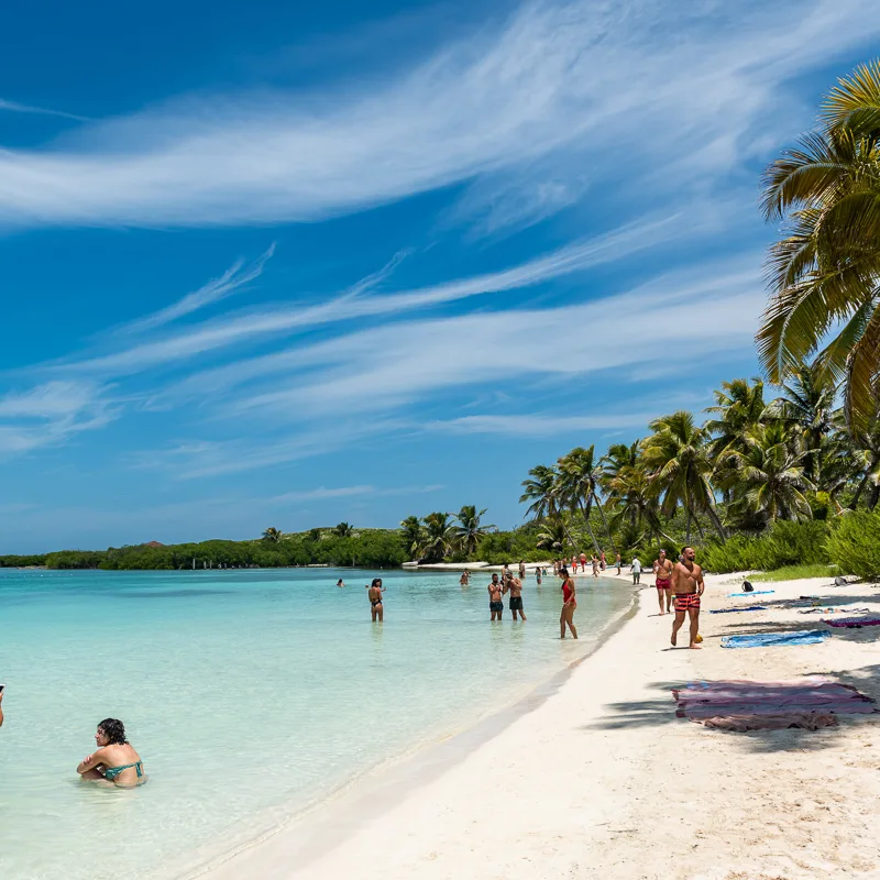 tourists enjoying beach in cancun