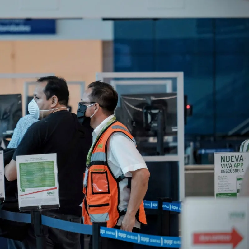 A man going through Cancun International Airport security.