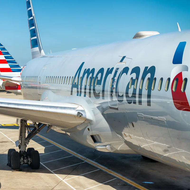 Side of an American Airlines plane leaving a U.S. airport.