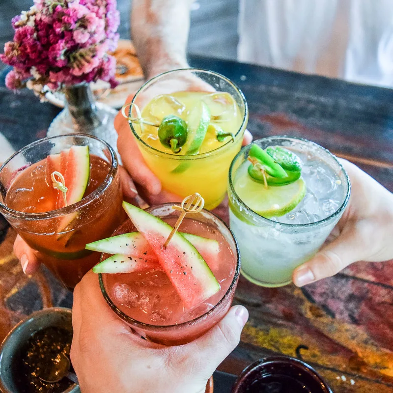 cheers with cocktails
