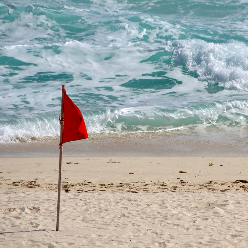 red flag warning on cancun beaches