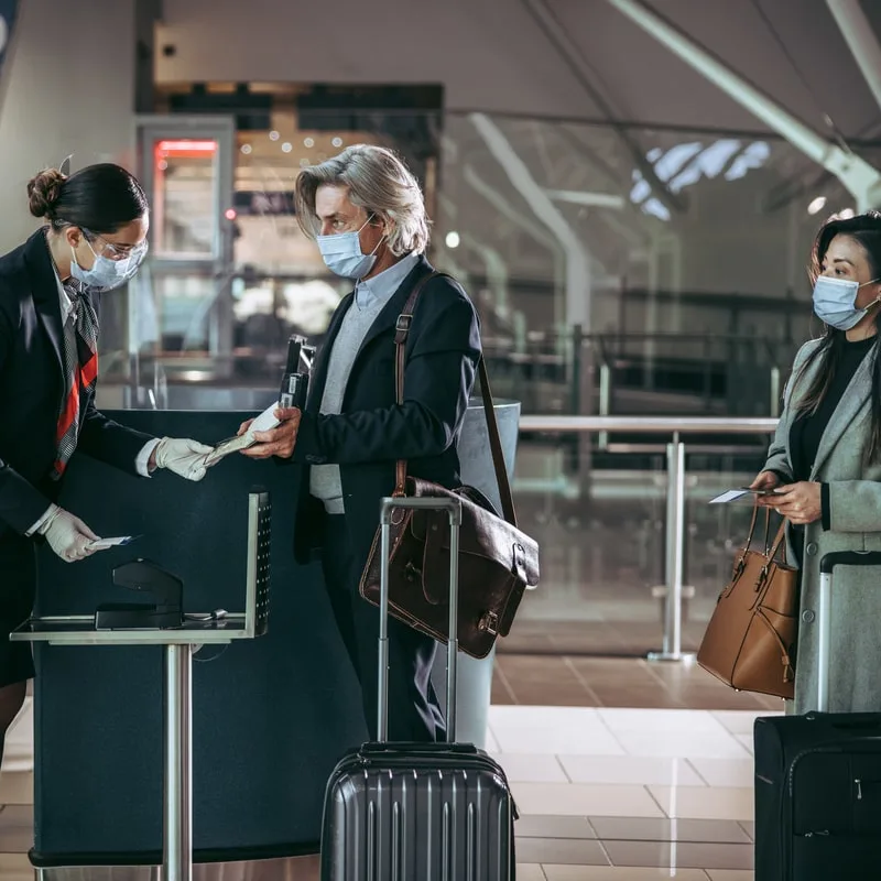 passengers about to boars wearing face masks