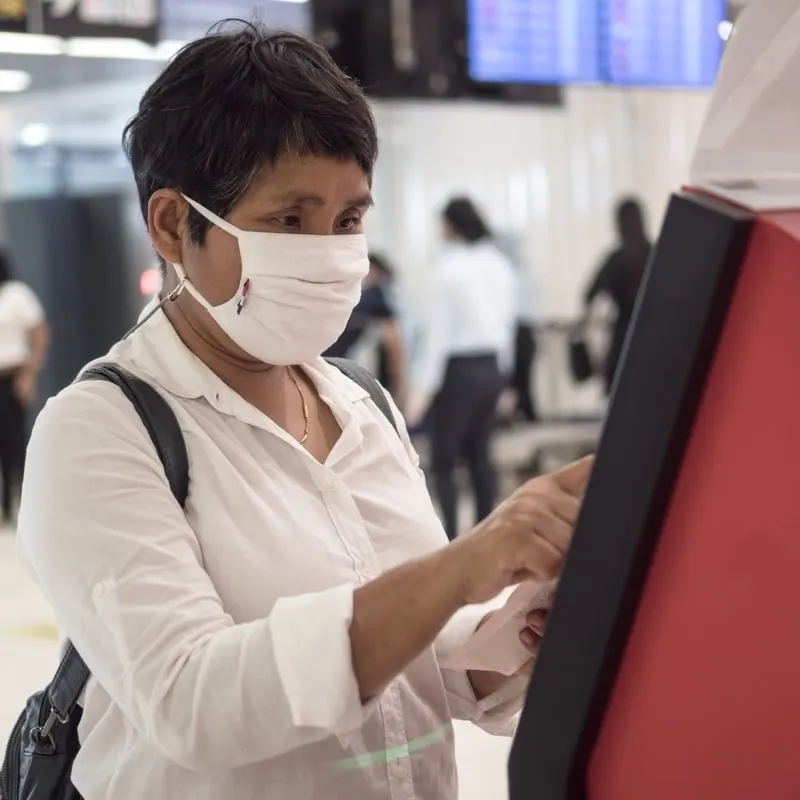 woman buying tickets at the airport