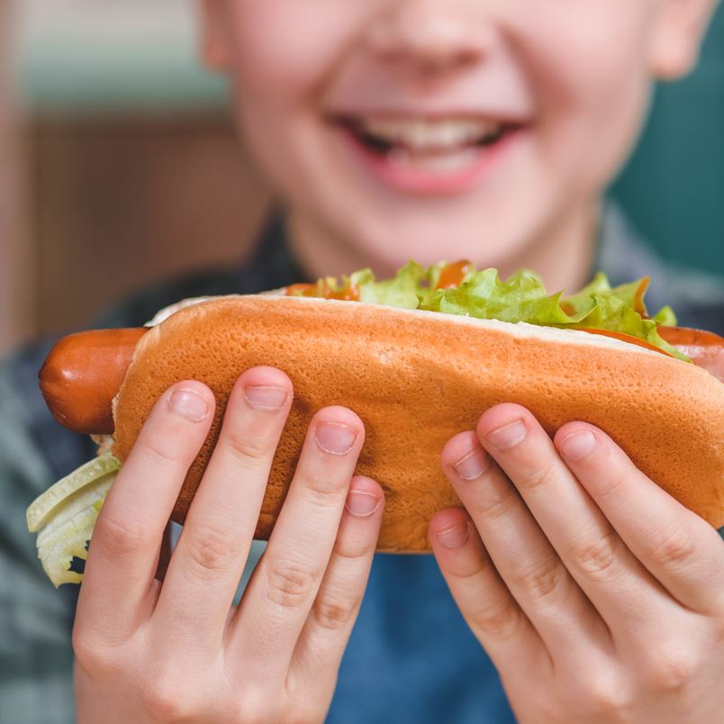 Child Eating a Hotdog 