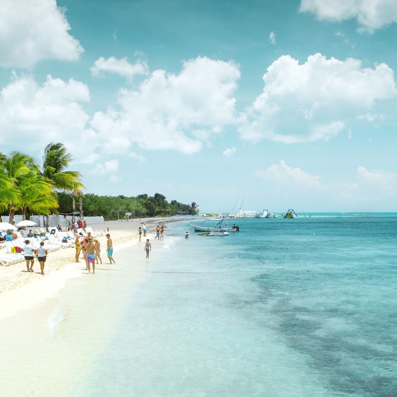 Pristine Cozumel Beach With Tourists Walking