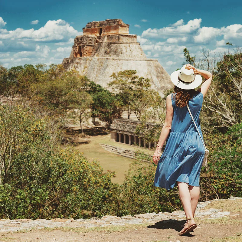 Young woman looking at Uxmal