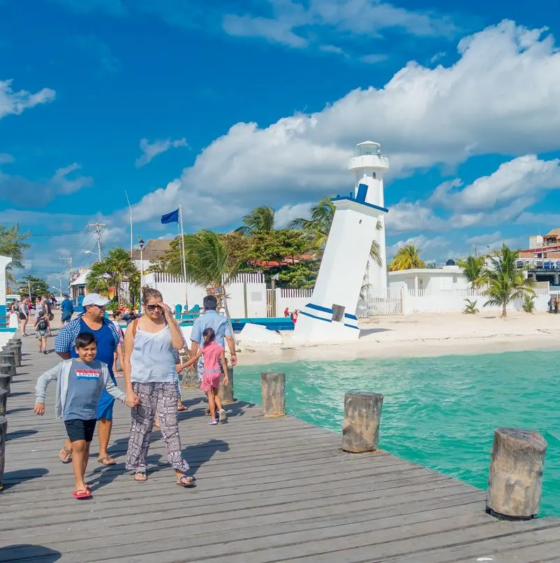 Tourists on the boardwalk in Puerto Morelos