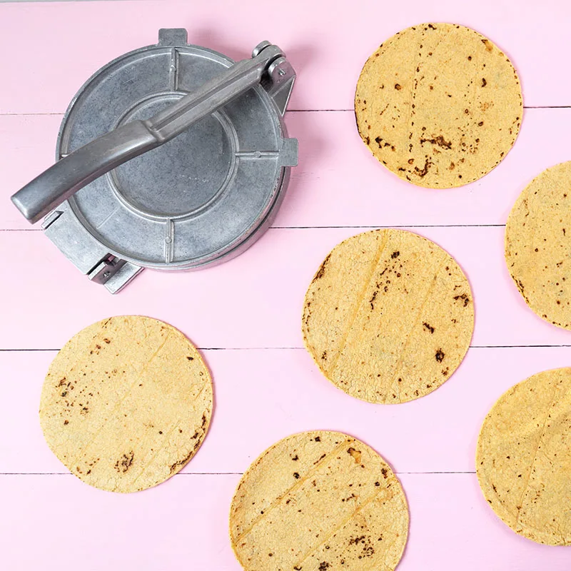 Tortilla press with fresh tortillas